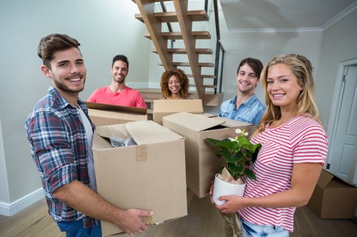 Moving boxes and protected furnishings in a Knightsbridge home