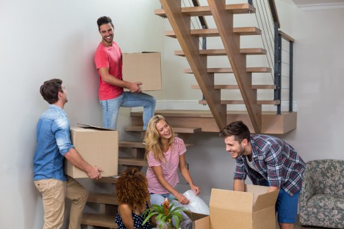 Removal van and boxed household items ready for collection