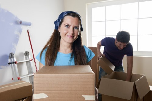 Packed boxes and moving equipment in a central London property