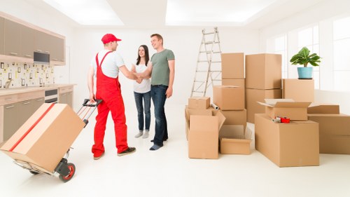 Removal crew loading household furniture near Knightsbridge