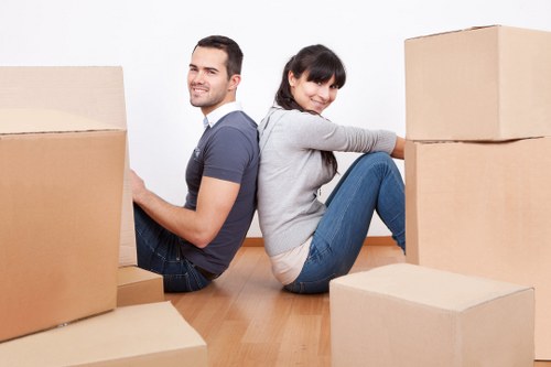 Packers preparing furniture for a townhouse relocation