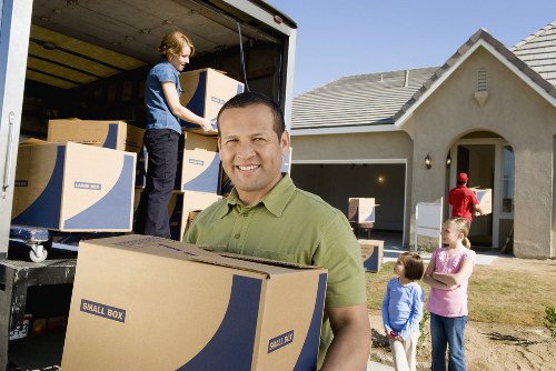 Team maintaining safe working standards during a house move